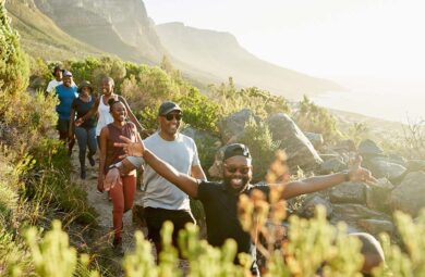 A group of hikers trekking on a mountainside, enjoying the scenic beauty and adventure of the outdoors